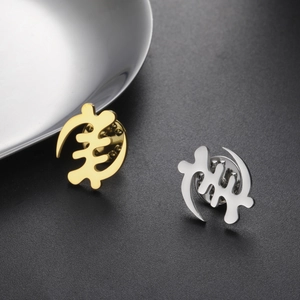 Polished gold and silver Gye Nyame symbol pins with metal butterfly clutches