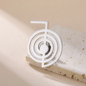 Minimalist silver Cho Ku Rei spiral cross brooch in polished stainless steel for women