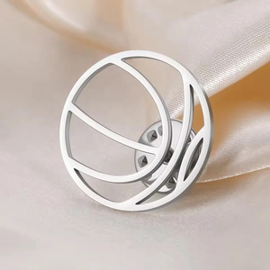 Macro shot of silver stainless steel tennis racket brooch with polished hollow design