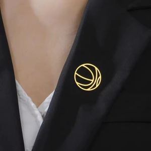Minimalist golden basketball brooch in 304 stainless steel on a dark suit lapel