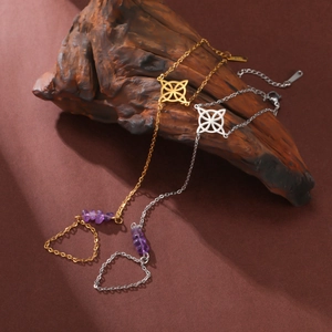 Detailed shot of stainless steel slave bracelet with purple crystal and Celtic knot