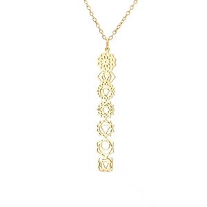 Golden stainless steel necklace featuring seven vertical hollow chakra symbols on white background