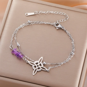 Detail of stainless steel double chain bracelet with purple crystals and knot pendant