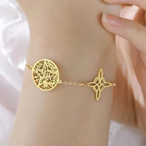 Vintage stainless steel gold bracelet with Virgin Mary and Witch's Knot occult charms