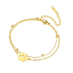 Dubbellaagse gouden roestvrijstalen armband met kralen en een opengewerkt kattenpootje