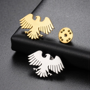 Polished eagle silhouette brooches in gold and silver finish with secure metal backings