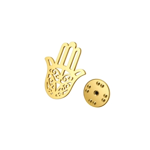 Golden Hamsa Hand brooch with intricate filigree cutouts and secure clutch backing