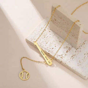 Golden stainless steel baseball bat necklace with Never Give Up engraving on textured stone
