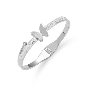 Detail of silver butterfly bracelet with matte wings and sparkling zircon stone inlay