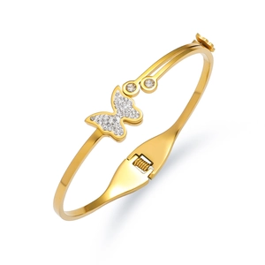 Polished gold butterfly bangle featuring sparkling zircon inlay and spring closure design