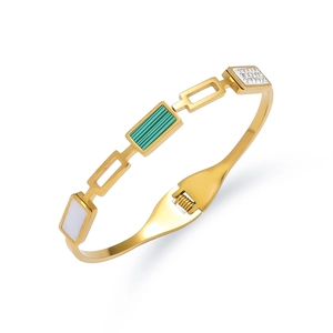 Retro goudkleurige roestvrijstalen armband met groene inleg en zirkonia accenten