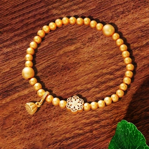 Vintage Goldperlen Armband mit hohlem Blumenanhänger und Lotuskapsel Charm für Frauen