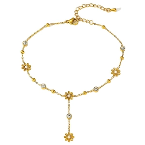 Elegant gold anklet with daisy charms and zircon accents on a white background