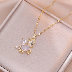 Exquisite golden dragon pendant necklace with oval zircon on a luxury silk jewelry box