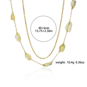 Double-layered gold chain necklace with pale yellow natural stone oval pendant