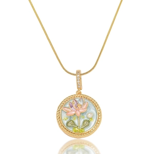 Close-up of enamel lotus flower pendant with freshwater pearls and gold chain