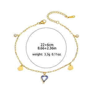 Detail of a gold titanium heart bracelet with purple crystal and sizing specifications