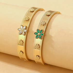 Golden open bangle with colorful zircon floral accents and elegant beaded edge detailing