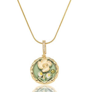 Elegant gold flower necklace with green enamel pendant and white zircon petals