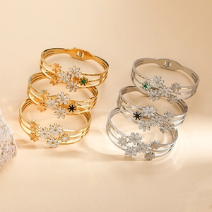 Elegant multi-layered gold and silver sunflower bangles set with colorful enamel details
