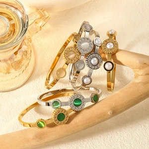Vintage 18k gold plated stainless steel bangles with green glass and zircon accents
