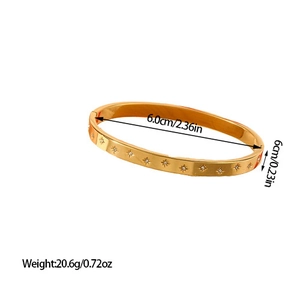 Polished gold stainless steel star bangle with zircons, dimensions 6.0cm by 6mm