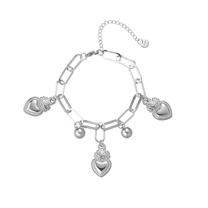 Macro shot of silver stainless steel paperclip chain bracelet with heart pendants