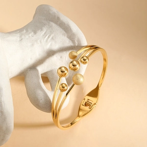 Gold plated stainless steel layered bangle with polished and matte beads for women
