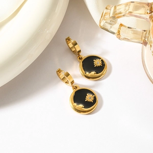 Elegant gold-plated sun and moon earrings set in celestial stainless steel design
