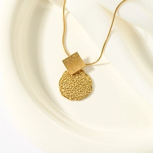 Vintage gold necklace set with irregular hammered square and round coin pendants on snake chain