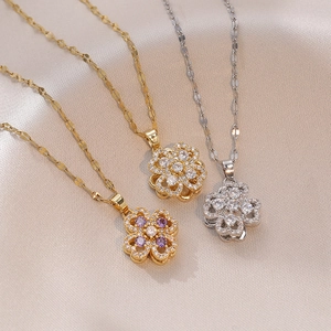 Drehbare vierblättrige Blumen-Halskette in Gold und Silber mit funkelnden Kristallen