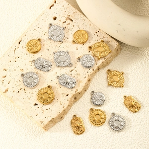 18K gold plated celestial starburst pendants with engraved sun and compass motifs