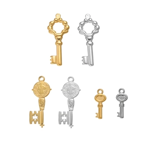 Set of six vintage stainless steel key pendants in gold and silver finishes for DIY jewelry