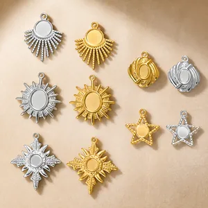 Detailed view of various geometric stainless steel charms with gold and silver finishes