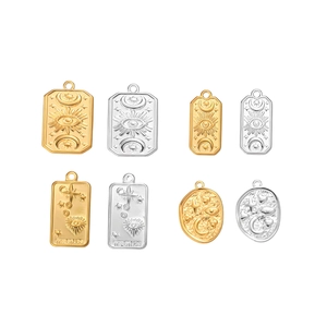 Set of tarot-style stainless steel pendants with sun star and moon motifs in gold and silver