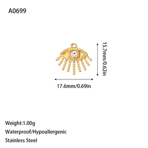 Detail of waterproof stainless steel evil eye pendant with gold finish and beaded fringe
