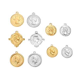 Macro detail of retro coin pendants with embossed Virgin Mary and historical icons