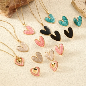 Elegant heart-shaped jewelry set with necklace and stud earrings in assorted enamel colors