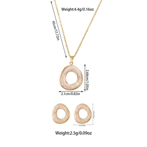 Detail view of pink pearlescent jewelry set with specific size and weight measurements