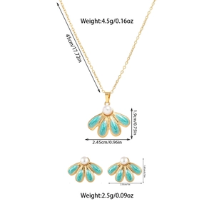 Detail view of sky blue enamel fan-shaped necklace and earring set with pearls and sizes