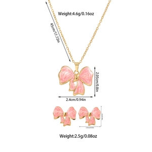 Detailed size chart for pink bow jewelry set showing titanium steel necklace and earrings