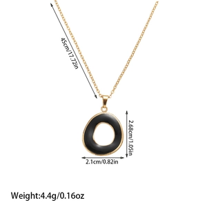 Detail showing dimensions of gold chain necklace with asymmetric black oval pendant