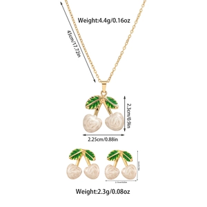 Detailed view of cherry pendant necklace and earrings set with size and weight specs