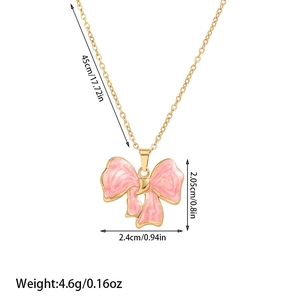 Detailed view of pink bow pendant necklace with dimensions and gold chain measurements