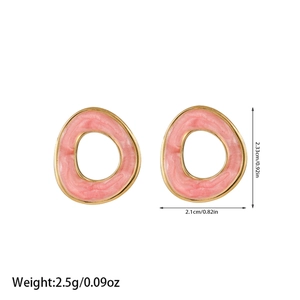 Detailed view of gold oval earrings with pink marble texture enamel and dimensions