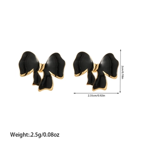 Detail view of black enamel bow stud earrings with gold edges and dimension markings