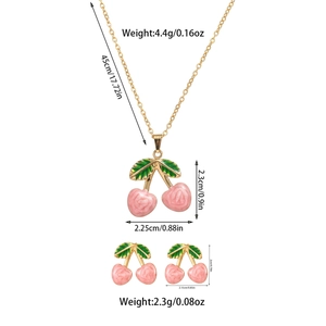 Detailed view of pink cherry necklace and earrings set with measurements and gold plating