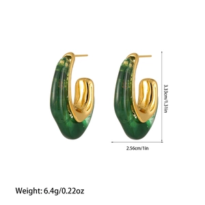 Detail view of U-shaped gold earrings with forest green resin, sized 3.33cm x 2.56cm