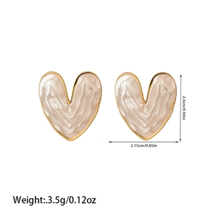 Detailed view of heart-shaped gold studs with marble texture and dimensions