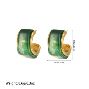 Macro shot of gold C-shape earrings with green marble resin inlay and size specs